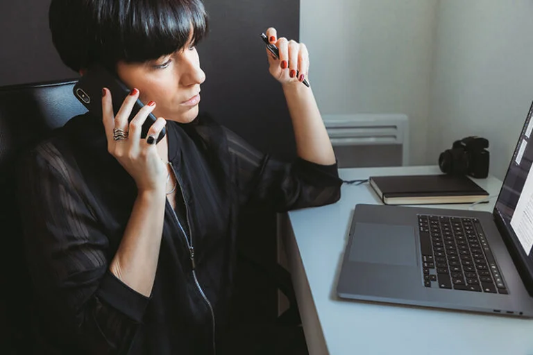 woman watching remote IT support happening on computer